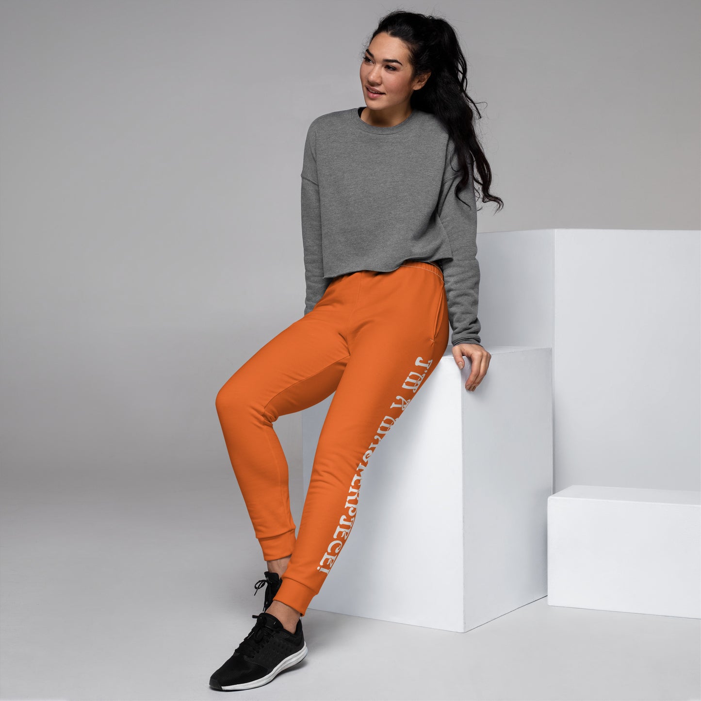 “I’M A MASTERPIECE!”Orange Women's Joggers W/White Font