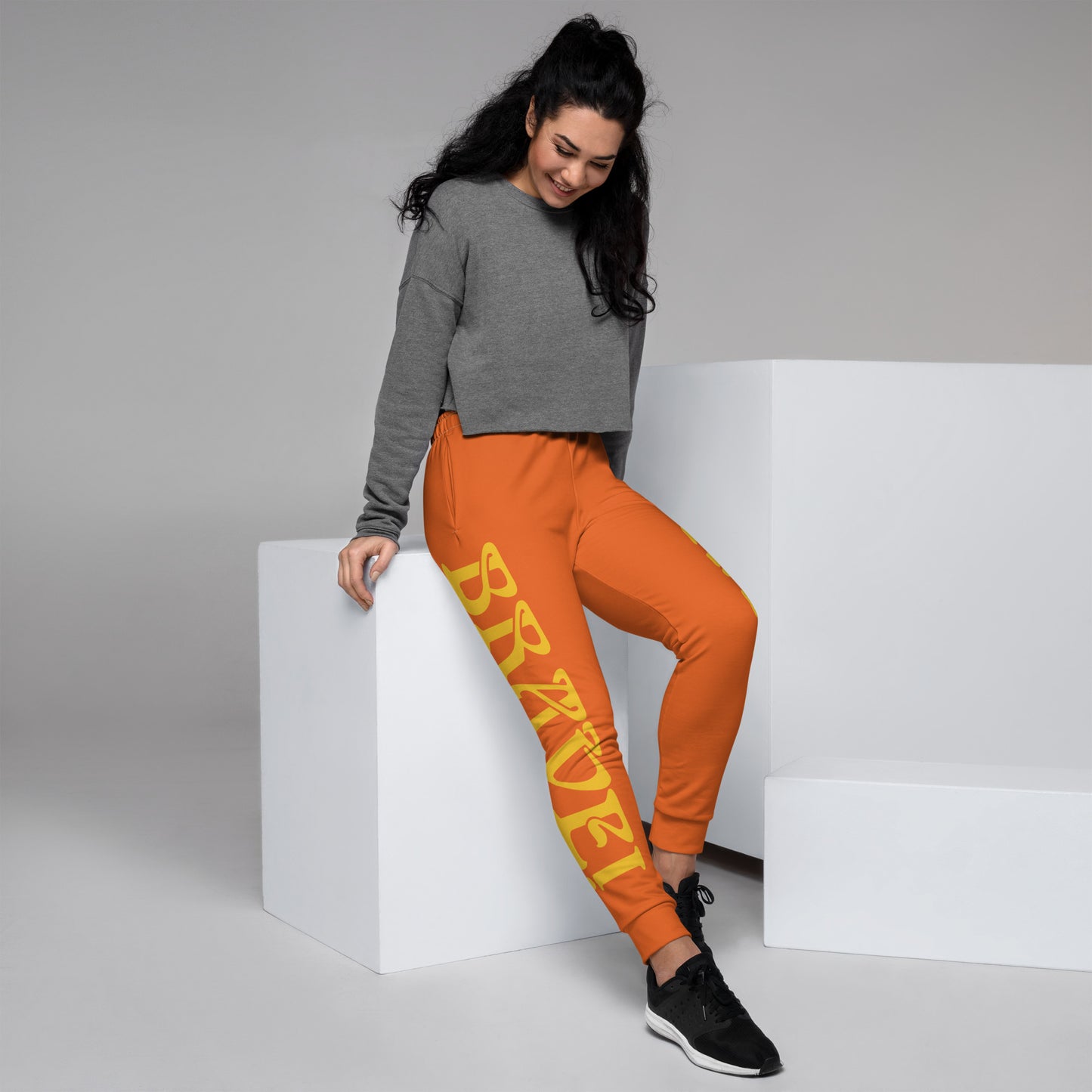 “BRAVE!”Women's Orange Joggers W/Yellow Font