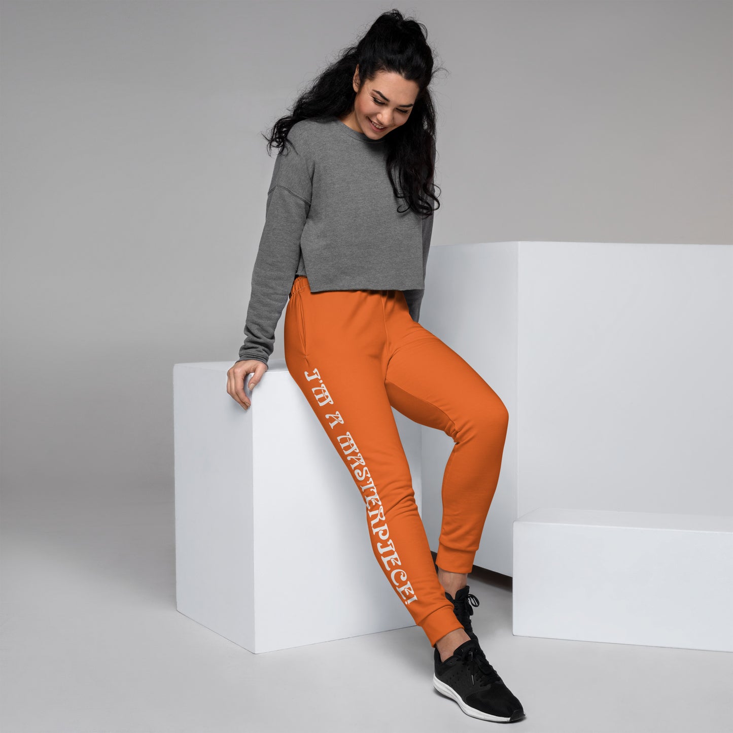 “I’M A MASTERPIECE!”Orange Women's Joggers W/White Font